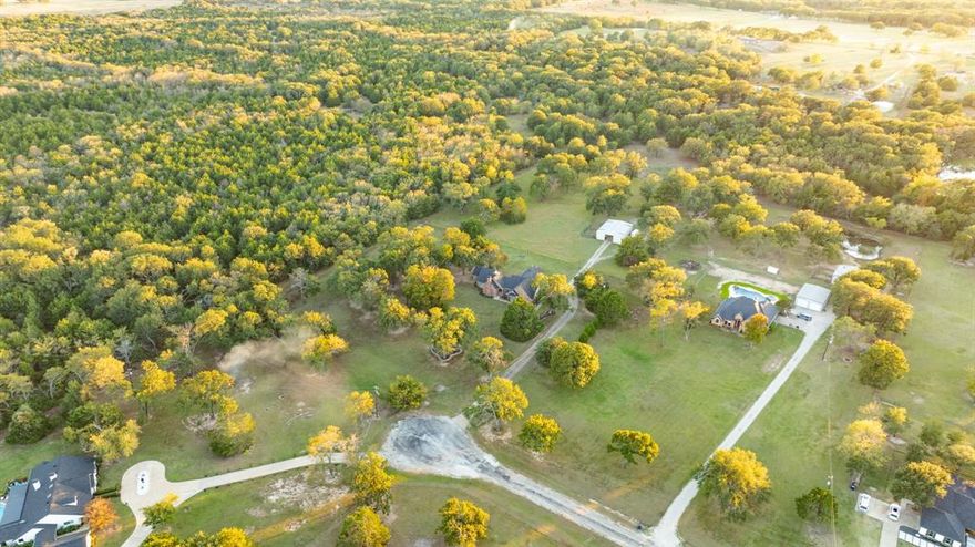 Bring your horses, your family, and your dreams! This peaceful country retreat sits on 5.6 cross-fenced acres at the end of a quiet cul-de-sac surrounded by towering trees and nature’s serenity. Homeowners enjoy access to stocked fishing ponds, making it the perfect blend of recreation and relaxation.
The beautiful 36x48 2 stall barn includes stables, a workroom, and ample storage, and has water and electricity ideal for horses or hobbies. Inside, you’ll love the spacious split-bedroom layout, a large den that can serve as a game room or second living area, and a cozy wood-burning stove under vaulted ceilings.
Recent upgrades include a new roof (2023), new septic, and new aerobic system (2023) New electric cooktop, New AC unit (2023)—giving you peace of mind and move-in comfort. This home shows PRIDE OF OWNERSHIP! Experience the quiet life you’ve been dreaming of with room to roam, breathe, and enjoy the country lifestyle just minutes from town- 10 min I-20, hwy 80 and 175! Great location! DO NOT MISS THIS ONE!