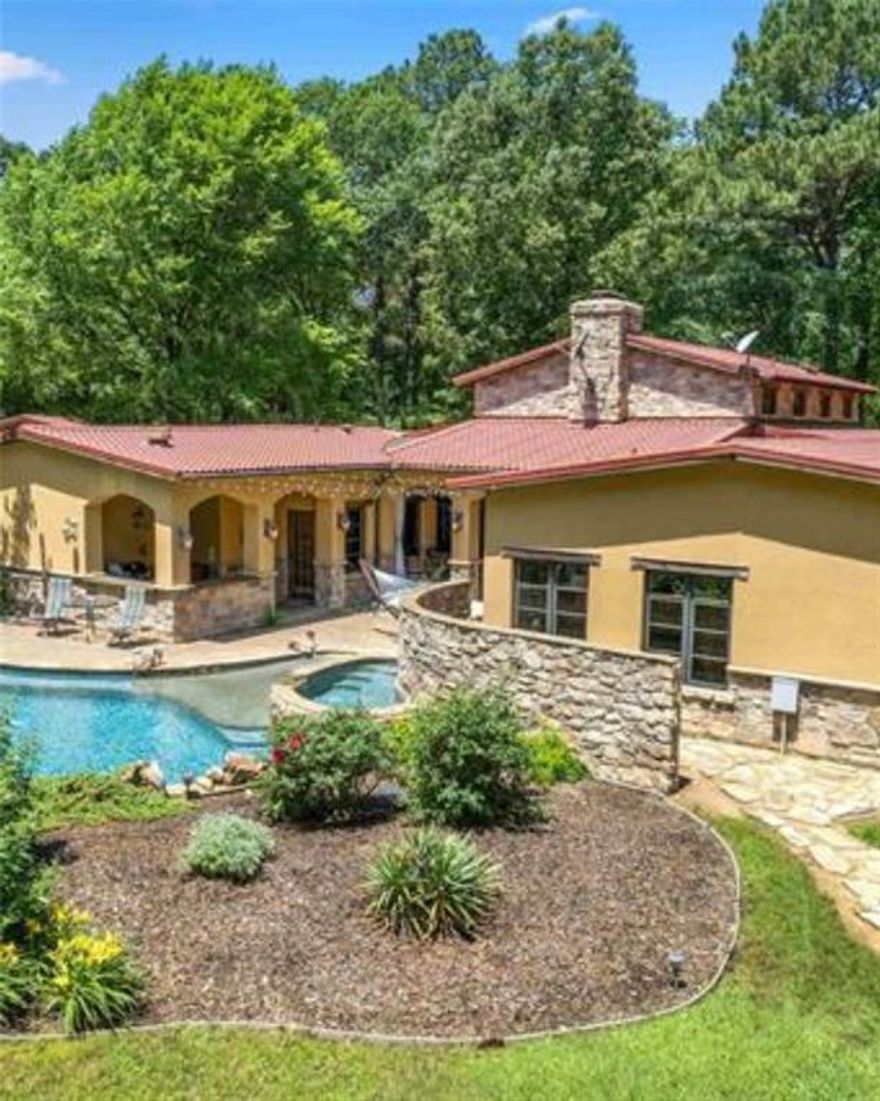 Introducing your exquisite custom-built Tuscan estate nestled on 13.89 acres of scenic East Texas landscape. This stunning residence features 4 bedrooms, 2 full bathrooms, and 1 half bath, complemented by a gourmet kitchen designed for culinary mastery.

Step inside to discover high ceilings, exposed wooden beams, and a cozy fireplace, creating a warm and inviting atmosphere perfect for hosting guests or unwinding with loved ones.

The gourmet kitchen is a chef's paradise, equipped with top-of-the-line appliances including a gas double dutch oven, range, and grill. Enjoy culinary delights in multiple dining areas, a breakfast bar, or the separate formal dining room. The kitchen overlooks lush gardens and an outdoor patio, ideal for al fresco dining and relaxation.

Retreat to the lavish master suite, featuring a spa-like ensuite bathroom and a private sitting room with built-in shelving for a library. Three additional bedrooms offer ample space for guests or family members, while a dedicated home office provides a serene workspace.

Outdoors, a sparkling pool and hot tub set in beautiful stone beckon for leisurely days in the sun. The meticulously landscaped grounds, adorned with lush timber, create a tranquil oasis in the heart of Pittsburg, Texas.

Seize the opportunity to turn this dream estate into your reality. Contact us today to arrange a private viewing and embark on the journey to make your Tuscan-inspired living dreams come true!

TAXES:  SOURCE COUNTY APPRAISAL DISTRICT