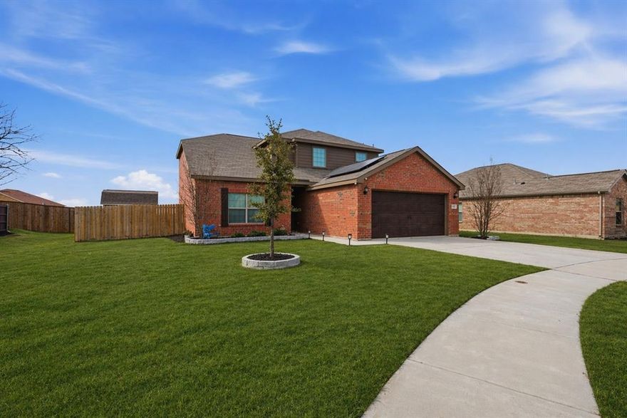 Nestled on a quiet cul-de-sac on an expansive .34-acre lot, this distinguished Cypress plan in Chisholm Springs is a rare opportunity to own a 2021 build elevated by meticulous curation and genuine pride of ownership. Lovingly maintained by its original owners, the home unfolds across an open-concept layout where updated laminate flooring flows seamlessly through the main level, complemented by fresh tile in the kitchen, powder bath, and primary suite. The kitchen anchors the living space with granite countertops, designer cabinetry, a custom-shelved walk-in pantry, energy-efficient appliances, and battery-operated pendant lighting. Cohesive decorative lighting, ceiling fans, and bespoke touches throughout lend a polish that photographs beautifully and lives even better. Main-level primary suite offers a quiet retreat with a well-appointed ensuite bath and generous walk-in closet. Three spacious upper-level bedrooms provide graceful flexibility for guests, a home office, or an expanding household. Backyard Oasis – A Showstopper. The fully fenced yard has been thoughtfully transformed into a private outdoor sanctuary featuring: Crafted deck + extended covered patio, Pergola with shade sail + string lighting, Fire pit + built-in outdoor bar, charming barn-style storage with electricity + additional storage shed. Smart & Efficient: Solar panels, Whole-home water filtration system with reverse osmosis. Unbeatable Location: Community pool & playground directly across the cul-de-sac, Fitness center, clubhouse, and scenic jogging paths moments away. Highly regarded Northwest ISD. This one has it all – and it shows like a dream. Schedule your showing today.