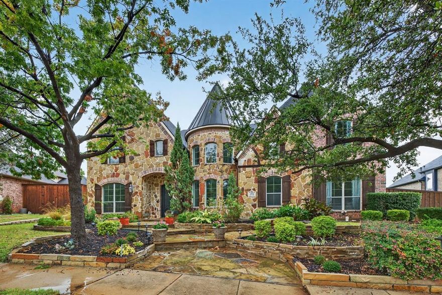 Open House Rescheduled until Dec 5th. Luxury Shaddock-Built Showcase Home in Highly Sought-After Stone Creek. Experience refined living in this 5-bedroom, 4.5-bath, 5,282 sq ft Shaddock-built luxury residence located in the prestigious Stone Creek community of Frisco, feeding into some of the area’s most highly rated Frisco ISD schools. The moment you enter, you're greeted by soaring ceilings, dramatic exposed beam details, and a floor-to-ceiling custom stone fireplace, beautifully anchored by walls of windows that bathe the great room in natural light. The chef’s kitchen is an entertainer’s dream—featuring professional-grade JENNAIR appliances, granite countertops, custom cabinetry, butlers pantry and a spacious walk-in pantry. A generously sized formal dining room is ideal for holiday gatherings and celebrations. The elegant executive office showcases custom shelving, cabinetry, and millwork—perfect for today’s work-from-home lifestyle. The first-floor private primary suite is a serene retreat with bay windows overlooking the backyard oasis. The spa-inspired primary bath offers dual vanities, a separate shower, jetted tub, and a large walk-in closet. Upstairs, enjoy a full entertainment wing complete with a game room and wet bar, expansive media room with an outdoor balcony, and a dedicated study or home school classroom with built-ins, storage, and chalkboard—ideal for homework, homeschooling, or creative space. Three additional bedrooms include a Jack-and-Jill layout and one private ensuite. Step outside to your ultra-private backyard paradise, featuring a resort-style lagoon pool, spa, and waterfall, a fully equipped outdoor kitchen, and a wood-burning fireplace—creating the perfect setting for year-round outdoor living and entertaining. Additional highlights include a full 3-car side-by-side garage and unbeatable access to all of Frisco’s top attractions, plus easy proximity to the DNT, SRT, and major conveniences. Luxury, location, and lifestyle!
