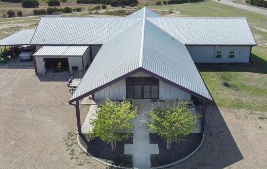 Lovely church on a rural hilltop, with beautiful views. Main area of the building has multiple entrances, vaulted ceiling, two balconies, beautiful chandeliers, and a baptismal pool in the sanctuary. 16 total rooms, including 2 apartments. Nine additional rooms on two levels for offices, changing rooms, classrooms, etc.,  and multi-stall restrooms.(Sounds like a great wedding venue, no?)
 Outside you will find about 240° of uninterrupted countryside views. Two attached carports, workshop and two storage buildings. Also, a pond and well house. Partially fenced with an electric gate entrance.
  No congregation? This former church is a unique opportunity for residence, residential income,  commercial, non-profit, RV lots, retreat,  value add, investment, or even a house hack. No known restrictions so you can build a house, add barns,  etc. Currently a main residence, the property also includes two approximately 950 sqft., two bedroom apartments (previously rented for $1000 per mo)  Electricity for RV pads is in place. You just need to follow the already made plans for a 20 space RV park. 
Seller financing available. Building can be bought with all 8.28acres, or 5 acres.