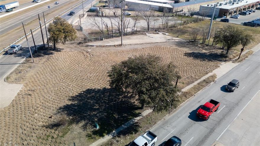 Small but impactful site available on the hard corner of Galloway and Highway 80.  All of us old timers of Mesquite remember the Williams Chicken who once stood there on that corner.  TXDOT took over and will be expanding the road access to the feeder road along with bridge widening.  A concrete triangular pad was left behind and is available for a small business.  Approximately 5,000 SF remains which is shown on the photos.  The front dirt area will be used as the new road expansion drive to the feeder road.  Possibilities are kiosk type businesses or very small office.  TXDot did grant ingress and egress from Galloway to this site.  Imagine all the cars driving past this site each day.  TXDOT plans are available in the transactions.  City of Mesquite is open to discussion for prospects.  This site is in the Truman Heights Overlay plan so that needs to be considered in development and use.