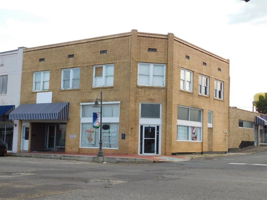 LOCALLY KNOWN AS THE TENNYSON BUILDING, THIS PROPERTY HAS 4 RENTABLE FIRST FLOOR SPACES WITH 3 LEASED AND AN UPSTAIRS APARTMENT ALSO.