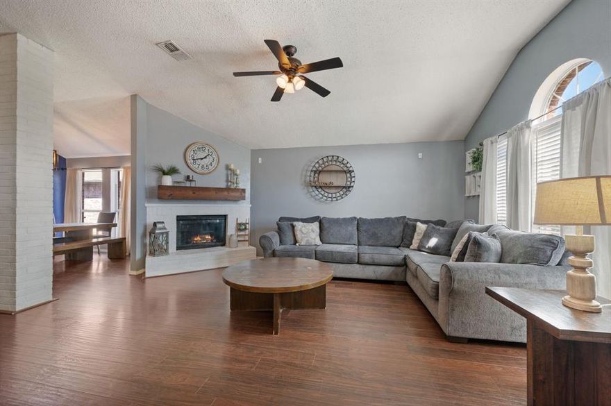 Welcome to this beautifully maintained 3-bedroom, 2-bath home with a 2-car garage ideally located in Arlington & zoned to the highly rated Kennedale ISD! Walking distance to Kennedale High School. Inviting entryway opens to an oversized family room with updated flooring, great natural light from a wall of windows and a cozy fireplace. Conveniently adjacent to the living room, the updated kitchen boasts newly painted white cabinets, stainless steel appliances, updated tile backsplash, breakfast bar, storage galore, walk in pantry & attached dining area. The spacious primary suite includes a soaking tub and separate shower. All bedrooms offer large walk in closets. Recently updated secondary full bath with NEW vanity, flooring, and lighting! NEW HVAC 2023, updated lighting throughout, recently painted interior. Enjoy the best of both worlds with a peaceful neighborhood feel and easy access to major highways, making commuting and travel a breeze.