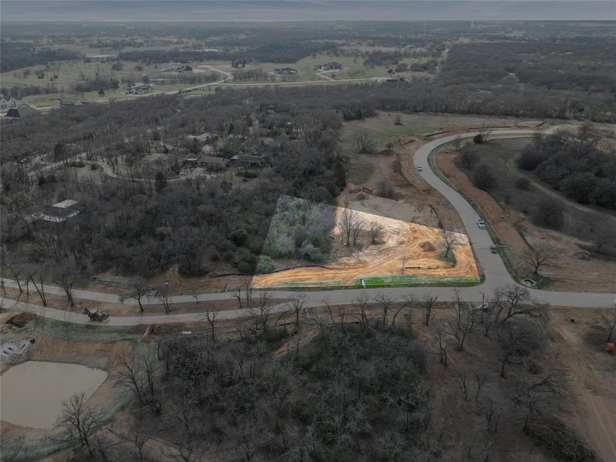 Red Bird Ridge presents a rare opportunity to build a custom luxury estate within one of Argyle’s most scenic and thoughtfully designed communities. Situated on a private 1 acre homesite, this lot is highlighted by beautiful mature trees that create a picturesque setting, offering both natural shade and enhanced privacy.

Positioned along the elevated northern ridge as a corner lot, this homesite enjoys a peaceful backdrop of mature post oaks, cedar elms, and native prairie landscape—blending timeless North Texas beauty with a true sense of tranquility. The generous lot size provides flexibility for a wide range of architectural designs, expansive outdoor living spaces, and potential additions such as a resort-style pool, guest quarters, or detached garage.

Red Bird Ridge is an exclusive 40-acre development with only 24 estate homesites, thoughtfully planned to preserve the land’s character while delivering modern luxury living. Residents enjoy tranquil ponds, scenic walking paths, and equestrian-friendly trails, all within a community centered around preservation and open space.

Located in the highly sought-after Argyle ISD and just minutes from Denton, Flower Mound, and convenient access to I-35W, this development offers the ideal balance of privacy, natural surroundings, and accessibility. With only a few homesites remaining, this is a rare opportunity to secure a premier homesite with beautiful mature trees and build a custom estate in one of North Texas’ most desirable locations.