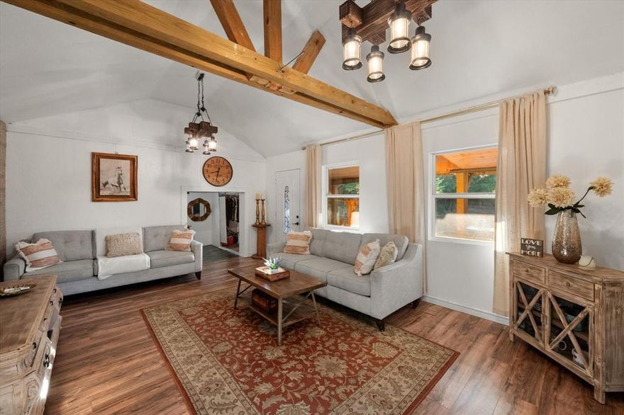 Charming, cute, and full of potential! This 2.175-acre property offers the perfect blend of country living and cozy comfort. Nestled among mature trees, along the creek the cabin features a full kitchen, a welcoming living room with a wood-burning stove, a bedroom, and a convenient half bath—an ideal retreat for weekend getaways, guest lodging, or simple living. With plenty of open space to expand, garden, or enjoy the outdoors, this beautiful slice of land is ready for your vision. Come experience the peace and privacy this unique property has to offer!  water meter and septic will need to be installed by buyer if used for full time living. Cash or conventional loans only.