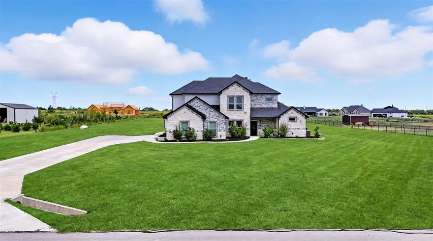 Experience luxury living on 2 acres in this beautifully designed 6-bedroom, 5.5-bathroom custom home. With a thoughtful layout and high-end finishes, this property blends elegance with functionality for everyday living. All bedrooms feature walk-in closets and recessed lighting, while the oversized garage, safe room, and hidden master suite room provide both convenience and peace of mind. The grand entry welcomes you with soaring ceilings and a designer chandelier, leading into a designated office and open-concept living spaces. The chef's kitchen is highlighted by premium Cambria quartz countertops, propane gas cooktop, modern cabinetry, and ample prep space. It flows seamlessly into the living room where a dramatic floor-to-ceiling fireplace and sparkling chandelier create a true showpiece. The primary suite is a private retreat, complete with a hidden room and spa-style bath featuring a jetted Jacuzzi tub, Japanese toilet with bidet, and smart LED mirrors with integrated lighting and exhaust. Each additional bathroom also includes quartz counters and smart mirrors for a consistent modern touch. Designed with convenience in mind, this home includes two laundry rooms, one upstairs and one downstairs ideal for large or multigenerational living. The oversized garage offers plenty of space for vehicles, storage, or hobbies, while the safe room provides extra security and peace of mind. Outdoor living is unmatched with a massive 1,560 sq. ft. covered patio perfect for entertaining, dining, or relaxing. With 2 acres of open space, the property allows plenty of room to customize with a pool, workshop, or garden while enjoying the peace of country living. Additional highlights include elegant chandeliers in the entry and living room, designer flooring throughout, and abundant natural light. This property combines luxury, functionality, and space, offering an exceptional opportunity to enjoy upscale country living just minutes from city amenities, shopping, and schools.