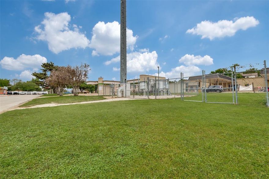 Great commercial Lot for a car wash or other business venture. Working on getting the tower removed. Call agent for more information.