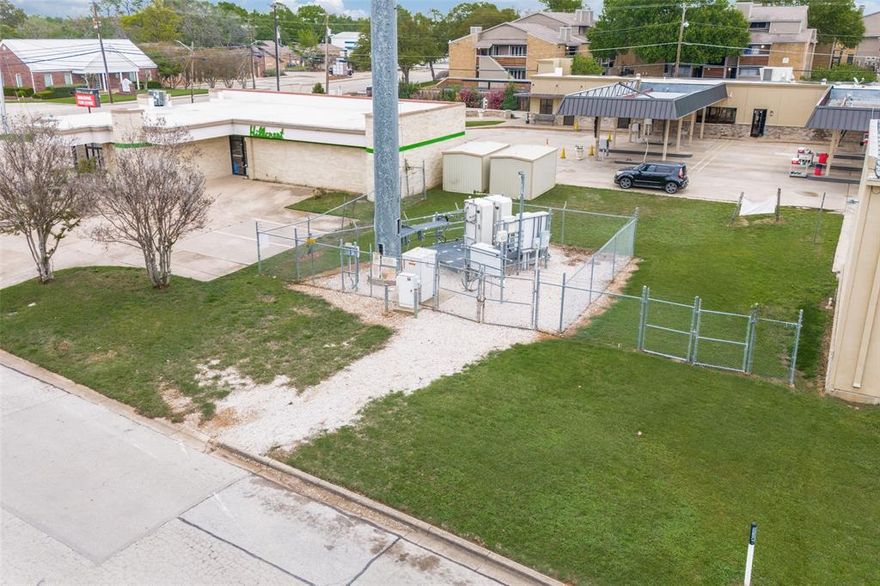 Great commercial Lot for a car wash or other business venture. Working on getting the tower removed. Call agent for more information.