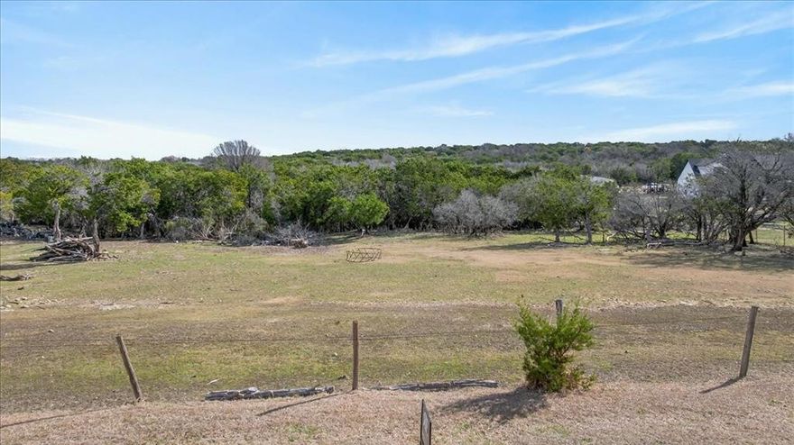 Discover the perfect blend of opportunity and natural beauty with this 3.10-acre tract in highly desirable Parker County, ideally situated between Azle and Weatherford and just minutes from Fort Worth. This prime location offers the best of peaceful country living with convenient access to city amenities, shopping, dining, and major highways.
The front portion of the property is cleared and ready for your vision, while the remainder features an abundance of mature trees and a scenic creek running through the land—providing privacy, character, and a beautiful natural backdrop.
Whether you're looking for an investment opportunity, planning a custom dream home, or exploring the potential for multiple new construction sites, this versatile property offers endless possibilities. With ample space and natural charm, it’s ideal for builders, developers, or buyers seeking room to grow.
Don’t miss this rare opportunity to own acreage in a rapidly growing area with strong future potential.  Electric, and water available at the street.  Previous owners installed septic on property, current owners have never used the septic.