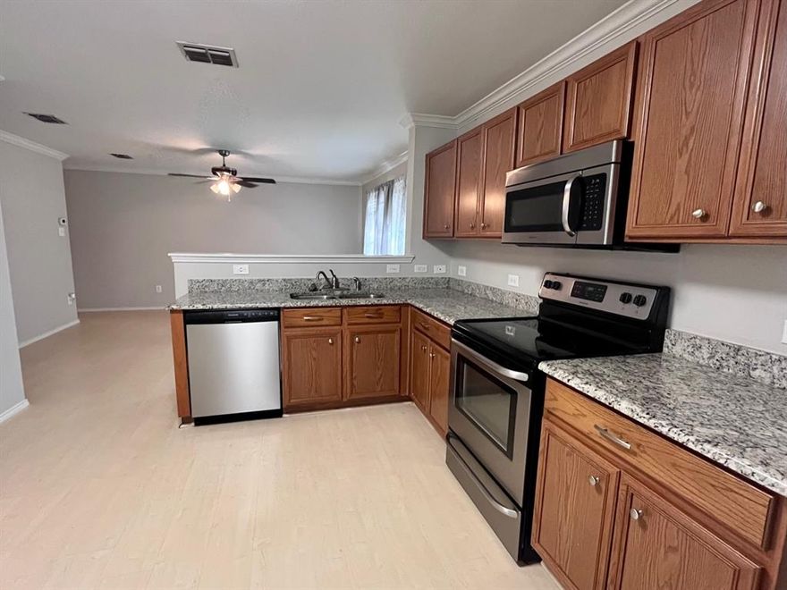 This spacious 3 bedroom, 2bath home with granite counter tops, stainless steel appliances, separate utility room with pantry and more! The kitchen is large with plenty of cabinet space and counter space! Backyard has wooden deck with cover! Great location in quiet community near HWY 34!