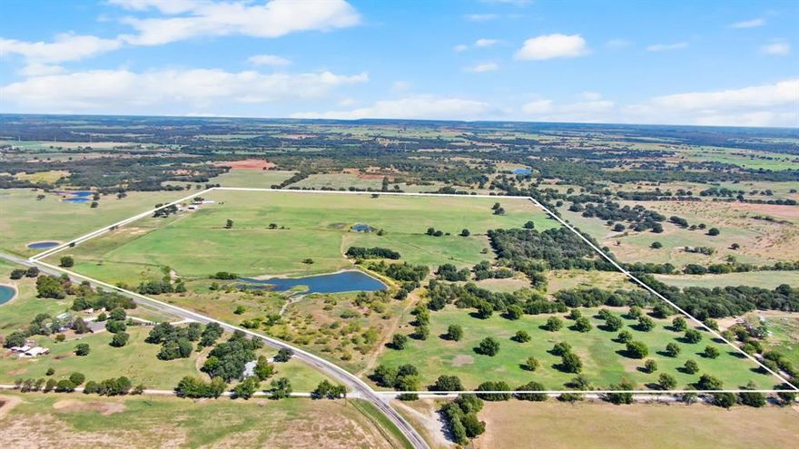 Welcome to 1401 FM 2921, De Leon, TX a truly unique property offering a beautifully renovated farmhouse, a second manufactured home, and an array of fantastic features that make it a dream come true for any prospective ranch owner. The main home of this property is the beautifully renovated farmhouse that exudes warmth and charm. Impeccable attention to detail has been paid to preserve its original character while incorporating modern comforts. The farmhouse is a true testament to the marriage of history and contemporary living. In addition to the main farmhouse, there is a second energy efficient spacious 2200 sq ft manufactured home on the property. The pastures are  covered in lush coastal Bermuda grass that's perfect for livestock grazing, or growing hay. With not one, but ten water wells, water supply should never be a concern.  This property is a rare find, offering an inviting blend of country living, modern comfort, and endless potential. Nestled in the serene De Leon, TX area.