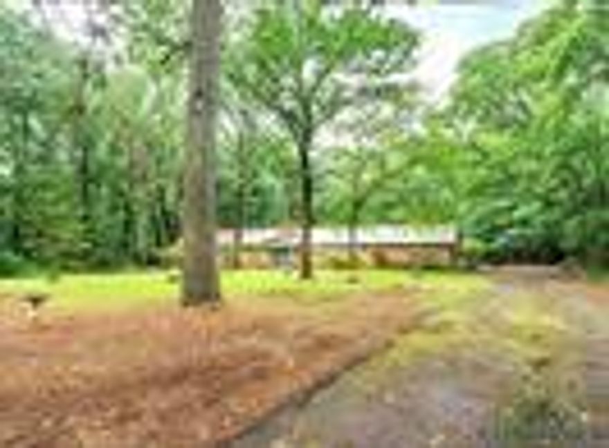 Charming 4-Bedroom, 3-Bathroom Retreat in the coveted Knight Forest neighborhood! This beautiful home sits on a 1.81-acre lot. 
Key Features: Back porch and custom deck. One custom-built storage shed workshop. 
Natural Beauty: Lush green grass and towering trees with a private and peaceful setting. Cozy Living: The spacious living room is centered around a grand fireplace. Large windows overlook the back porch. 
Entertainer's Dream: The separate dining area offers plenty of room for hosting gatherings and special occasions. The well-appointed kitchen features numerous cabinets and a central bar area. 
Comfortable Living Spaces: One bedroom has been transformed into a walk-in closet, but it can easily be converted back into a bedroom to suit your needs. Down the hall, you'll find three additional bedrooms and two bathrooms. The third full bathroom, complete with a shower, and is located just inside the home from the garage entry. Schedule a private showing today