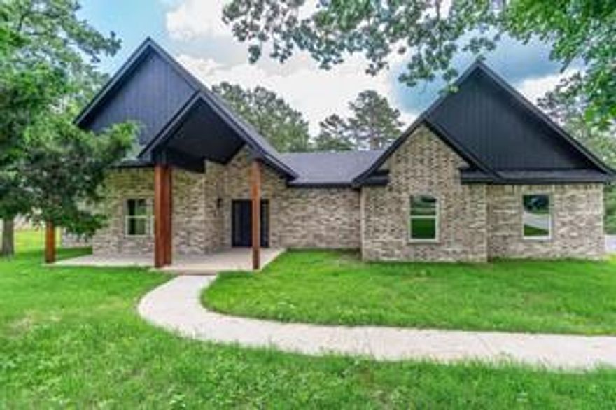 Welcome to this beautiful 4-bedroom, 2.5-bathroom new construction home in Mineola, Texas! Designed with a perfect balance of modern style and everyday functionality, this home offers an inviting open-concept layout that’s ideal for both entertaining and comfortable living. Step inside through the stately front porch and grand entrance, where you’ll be greeted by spacious living areas filled with natural light. The open-concept design seamlessly connects the living room, dining area, and kitchen, creating the perfect space for gatherings. The split floor plan provides privacy, with the primary suite tucked away for relaxation. It features a luxurious en-suite bath, complete with a walk-in shower, soaking tub, and dual vanities. Three additional bedrooms offer plenty of space for family, guests, or a home office. Enjoy the beauty of outdoor living on the covered back patio, perfect for unwinding or entertaining. With thoughtful design, high-end finishes, and a prime location, this home is the ideal blend of modern elegance and everyday practicality.