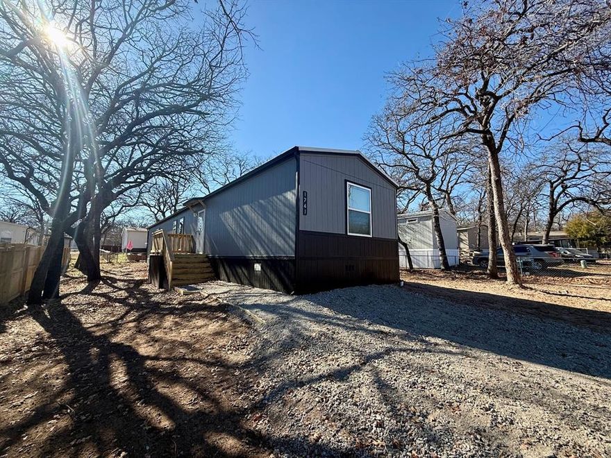 Come and Enjoy the Lake and live in a New 2025 Champion Home with two decks. Split bedrooms, luxury vinyl floors throughout the home and large pantry, refrigerator included! Home is surrounded by mature oak trees on a quite cul-de-sac. Community has a public boat dock where residents can launch for free and a free public beach and park. More Pictures Coming Soon!