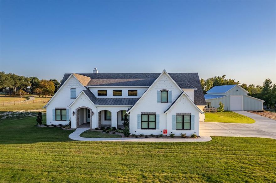 Welcome to your East Texas paradise! This brand new, show stopping home sits on 5.8 acres. Boasting 4 bed, 3.5 bath, and a spacious 4,350 sq ft of luxury living, this property has it all from the stunning pool to the versatile barn with a complete living suite! Step inside to a welcoming entryway that leads into a breathtaking living space. The kitchen is a chef's dream, featuring GE Monogram appliances, a commercial range cooktop, and folding panoramic windows. Right behind the kitchen, you'll find the ultimate utility room, a secondary kitchen, pantry, and laundry room all in one. The master suite includes an ensuite bathroom featuring a luxurious wet room, complete with a large shower and slipper tub enclosed behind glass doors. Head upstairs to find a cozy home movie theater for your entertainment needs. The panoramic sliding glass doors off the living room open to an outdoor oasis. The luxurious pool, hot tub, sunning deck, and gas firepit set the scene for endless relaxation.