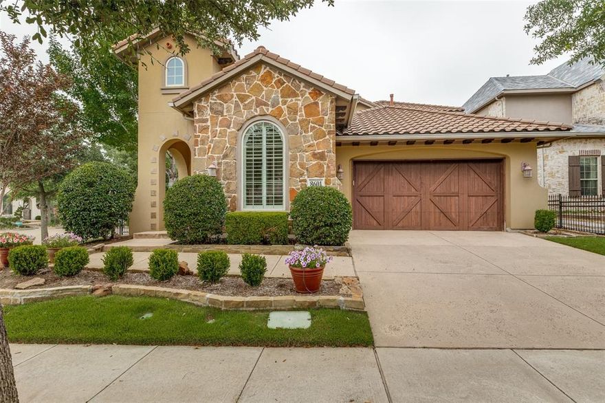 Situated on a 0.2-acre corner lot within the sought-after Craig Ranch community, this meticulously maintained, single-owner home offers a commanding presence with thoughtful design and low-maintenance living. A gated front courtyard leads to a covered, arched entry, creating a private, refined arrival. A striking Spanish barrel tile roof with multiple elevations enhances the home’s architectural character and durability. Positioned within the highly regarded Estates at Craig Ranch, this 2012-built home is ideally located in a master-planned golf course setting with access to TPC Craig Ranch, parks, and trails. Directly across the street, a scenic canal system—one of the community’s most distinctive features—offers walking paths and lush landscaping in a peaceful, park-like setting. Spanning nearly 3,700 square feet (appraiser-measured; larger than tax records), the light-filled, open-concept layout includes 5 bedrooms, 4 full baths, a dedicated office, and generous living and dining areas. The chef’s kitchen features wood cabinetry, granite counters, stainless steel appliances, and a large island with seating. Hardwood floors, plantation shutters, and a neutral palette create a clean, move-in ready aesthetic throughout. The private primary suite offers a spacious retreat with a spa-like bath including dual vanities, soaking tub, separate shower, and walk-in closet. Upstairs, a game room, bedroom, and full bath provide flexible space for guests or everyday living. Outdoor living shines with a resort-style pool and spa with wading deck, covered patio, screened pergola, and built-in grill with refrigerator. A rare opportunity to experience refined, amenity-rich living in one of McKinney’s most established communities. Zoned to Frisco ISD with convenient access to nearby dining, shopping, employers, and commuter routes including Sam Rayburn Tollway and US-75.