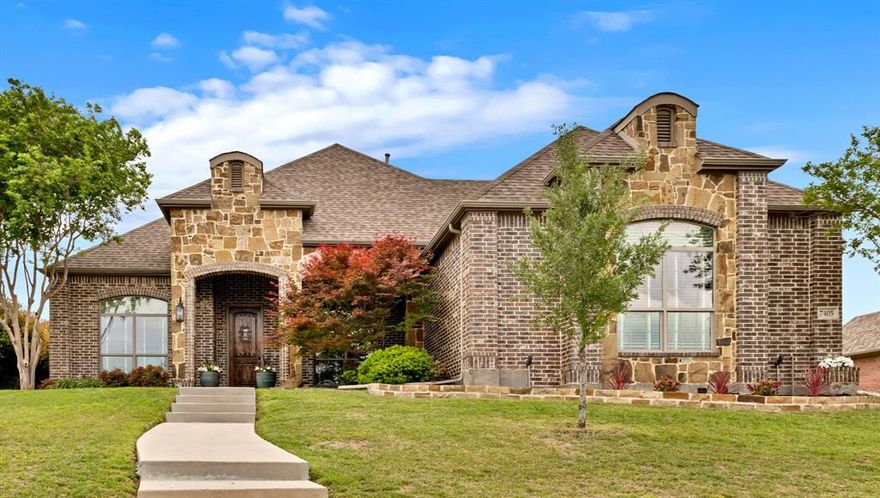 Elevated lot in sought-after Eagle Ridge, this custom two-story home offers stunning views, space, and flexibility on nearly half an acre. The main level features a private owner’s retreat with spa-like bath, dual granite vanities, jetted tub, walk-in shower, and oversized custom closet with built-ins. All secondary bedrooms are located downstairs, along with a formal dining room and a dedicated office with closet that could serve as a 5th bedroom. The gourmet kitchen includes a large island, granite countertops, double ovens, warming drawer, commercial-grade gas cooktop with grill, abundant cabinetry, and a walk-in pantry. Ceramic wood-look tile flows throughout the main level. Upstairs offers an expansive game-media room with full bath, bar, and generous storage—ideal as a second living area or guest quarters. Additional highlights include a 3-car garage with epoxy floors, pool-sized backyard, and covered front and back patios. Conveniently located near Eagle Mountain Lake.