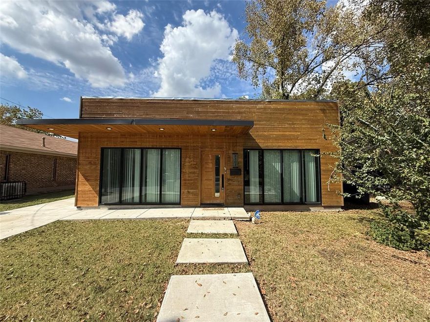 This one of a kind residence showcases expansive custom windows across the front, filling the home with abundant natural light. A striking Brazilian Mahogany front door with premium German hardware sets the tone for the modern craftsmanship within. Wrapped in beautiful cedar siding, a natural termite repellent, the exterior blends style and durability. Inside, the kitchen boasts rich mocha shaker cabinetry paired with warm butcher block countertops for a timeless, modern feel. Both bathrooms are designed with luxury in mind, featuring walk in rain showers, imported Spanish tile, premium navy vanities topped with Calacatta quartz, and elegant gold hardware and fixtures. Perfectly situated in the heart of Dallas, you’ll enjoy quick access to Deep Ellum, Downtown, and Uptown. This rare Dallas gem is truly a must see!