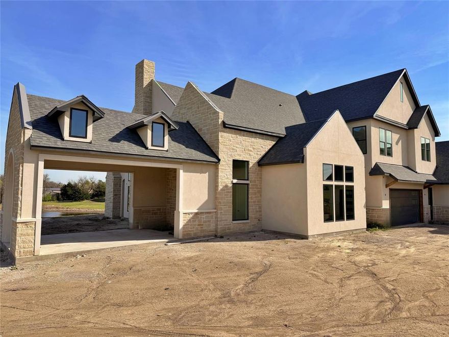 One-of-a-kind European-inspired estate on 3.88 acres with beautiful hilltop views. Located at 108 Eisenhower Court, this custom-built home offers approximately 6,260 square feet of well-designed living space, combining classic charm with modern comfort. Tucked behind a driveway in a quiet cul-de-sac, the home provides both privacy and impressive scale. Inside, you'll find 6 spacious bedrooms and 9 bathrooms, along with a separate pool or guest house—ideal for family living or hosting guests. The main floor includes a striking entryway, both formal and casual living areas, a gourmet kitchen, and the option for a main-level primary suite along with an additional bedroom, office, or guest space. The interior finishes were carefully selected by a senior designer, featuring high-quality quartz countertops, decorative tiles, and high-end appliances that add both function and style throughout the home. Upstairs offers more private bedroom suites and flexible space that can be used as a media room, gym, or playroom. Large windows and glass doors fill the home with natural light and highlight the peaceful surroundings. The home’s exterior showcases timeless European charm with white stucco, natural stone, and classic gabled rooflines. Two porte-cocheres—one at the main entrance and another leading to a separate building—add convenience and a sense of grandeur. A 4-car garage provides ample space for vehicles and storage. While full landscaping plans are still underway, the large lot offers plenty of room for outdoor living and future enhancements. There are glimpses of a pool area that hint at the potential for a private outdoor retreat.