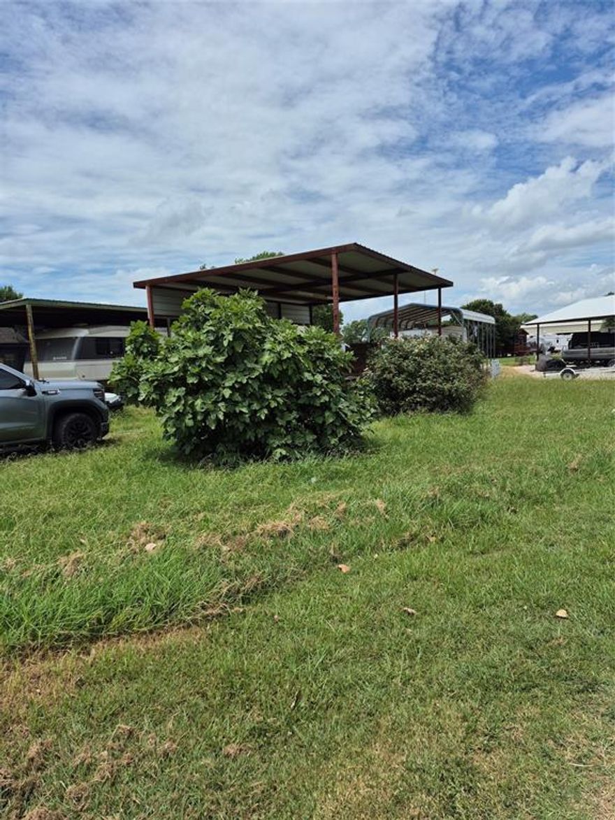 Bring your camper.  Awning and porch already there. Great lakeview lot