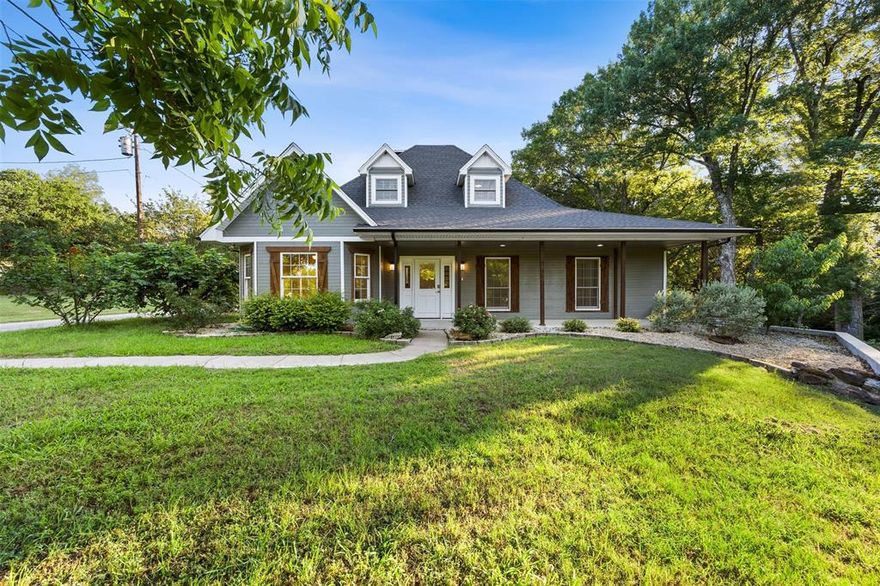 **Call the agent & ask how you can lower your payments for the first year @ 469.995.0358 ** Situated on just over 2 scenic, tree-covered acres in the desirable Rutherford Crossing community, this stunning 5-bedroom, 3.5-bath home offers the ideal balance of space, comfort, and peaceful country living. The well-designed floorplan features multiple living and dining areas, decorative lighting, a spacious kitchen with an island and pantry, and a warm wood-burning fireplace perfect for gathering. The private primary suite creates a relaxing retreat, while the secondary bedrooms provide ample space for family, guests, or a home office. Enjoy quiet mornings or entertaining evenings on the covered patio overlooking the expansive backyard. Located in Palmer ISD with no HOA, this property delivers the serenity of country living while remaining conveniently close to Waxahachie shopping, dining, and major commuter routes.