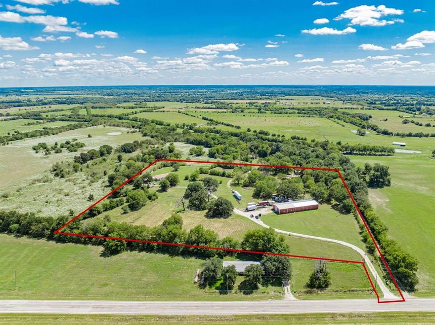 Once-in-a-lifetime opportunity to own this AMAZING property fronting I-30 just minutes east of Greenville! ALMOST 15 ACRES ON I-30! Seclusion and privacy along with the convenience of fronting I-30, all in one. There is so much growth happening in this part of Hunt County! Proven track record of running a business at this location for generations. Endless possibilities to develop into a any numerous business entities including: warehouse, storage units, retail, business distribution center, corporate retreat, etc. Could also be developed for residential, water and electric on site. This property features a 4800 sq ft metal building on a concrete slab with cooler storage, office, and roll up door. There are also two homes, freestanding garage, and barn on the property. The first home is a 3192 sq ft 5-3 tripe wide with two metal buildings. The second home is a 2 bedroom 2 bath cabin with a detached garage with RV parking. Come see this property today!