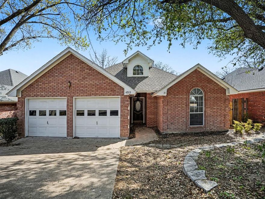 Welcome to Your Next Opportunity in Sought-After Arlington. Discover the incredible potential of 4915 Arborgate Dr, a 3-bedroom, 2-bathroom brick home situated in one of Arlington's desirable neighborhoods. This conveniently located property offers approximately 1,666 square feet of living space, centrally positioned about 20 minutes from AT&T Stadium, this home places you at the heart of Dallas-Fort Worth's premier entertainment district. Provides easy access to I-20 and US-287, making traveling throughout the DFW metroplex and reaching DFW Airport easier.  Enjoy shopping and dining options nearby, while Treepoint Park sits just moments away.
Inside, find a living room featuring high ceilings, a corner brick veneer fireplace, and triple windows providing the space with natural light and a formal dining area. The eat-in kitchen featuring a original stained cabinets and formica countertops along with a breakfast nook with five generous windows that provide natural light. All carpet and laminate wood flooring has been replaced with LVP 2026. No carpet in the house. The primary en-suite bathroom, complete with a corner soaking tub, separate shower, and dual vanity sinks. Outside, a wooden deck overlooks a completely fenced backyard—with some pressure wash, staining and personal touch it would look wonderful.
This home presents an exceptional opportunity for anyone ready to create their dream space. Don't miss your chance to own in this house. Schedule your showing today!
