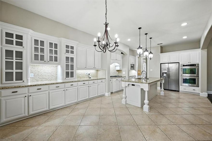 Welcome to this stunning Highland-built home in the prestigious Cascades of Stonebridge Ranch, offering the perfect blend of elegance, function, and resort-style living. With 5 spacious bedrooms, 4 full bathrooms, and a 3-car garage, this home is designed to impress. The grand entry greets you with soaring ceilings, a dramatic curved staircase, and hand-scraped hardwood floors that flow through the study, formal dining, living room, and hallways. A fresh custom interior paint job adds a designer touch that wows throughout. A private office with French doors, formal dining room, and spacious living area with a floor-to-ceiling stone fireplace make this home both luxurious and livable. The gourmet kitchen features an oversized Texas-style island, granite countertops, stainless steel appliances, a 5-burner gas cooktop, tumbled marble backsplash, and a generous breakfast nook. The primary suite is privately located on the main floor and features a spa-like bathroom with a jetted tub, oil-rubbed bronze fixtures, dual vanities, and a custom walk-in closet. A second bedroom with a full bath on the first floor is perfect for multi-generational living or guests. Upstairs, you'll find three additional bedrooms, two full baths, a large game room, and a dedicated media room, offering plenty of space for entertainment and relaxation. Step outside to your own private outdoor oasis, featuring a Foley built saltwater pool and spa, covered patio, and mature native trees providing both beauty and shade—ideal for enjoying warm Texas summers. Additional updates include a new roof in 2020, water heater in 2018, and board-on-board fence in 2019, plus two new HVAC units installed, one in 2021 and one in 2024. Brand new Pentair pool pump professionally installed-2025. Located in the highly acclaimed Stonebridge Ranch master-planned community, residents enjoy access to parks, trails, lakes, tennis, and the beach club. This home is truly a perfect 10—schedule your private showing today!