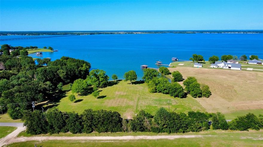Richland Chambers Lake Waterfront Paradise!  Lot 2-R of Moonlight Point at Richland Chambers Lake is 2.05 Acres in size and has over 400 linear feet of protected shoreline! This lot is ready to become your lakeside paradise with a steel retaining wall already in place! Lot 2-R is expansive in size with wide open lake views and a gentle slope down to the lake shore. The majority of the land is above the 320' build line, allowing room to build your custom lake home and still have a sprawling yard with beautiful mature trees.  The lot sits back slightly from the point, which means you have the benefit of nice, deep and protected water for your future boathouse, but get the sweeping open water lake views - the best of both worlds! Come take a look today and start making plans for your perfect lake retreat. Moonlight Point is deed restricted to site built homes with a minimum of 2,000 square feet of living space with no time limit to build.