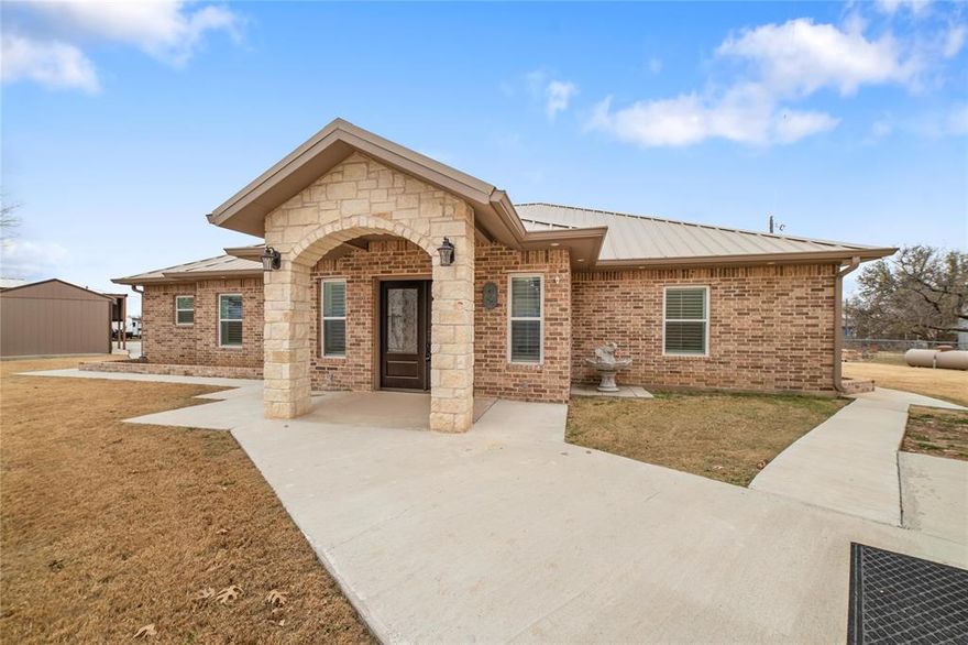 Lake life just got an upgrade. Custom built in 2022 this modern 2 bed 2 bath home is made for lake living & entertaining. Open concept design, granite throughout, oversized island, all the appliances plush washer & dryer are included. Durable hardwood-style tile flooring adds luxury and easy maintenance. Oversized garage. 16x10 storage shed. Then there is the party barn! Complete with it's own bathroom, games, custom lighting, & decor that conveys with acceptable offer. The party will never stop with the back up power Generac. Bring your friends. Bring the fun.