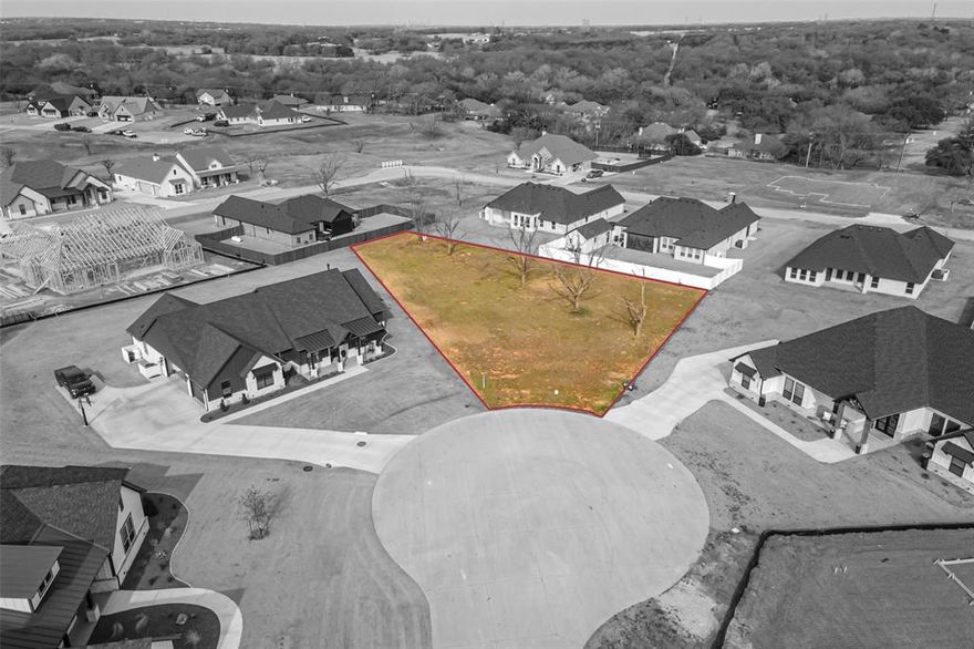 Build your dream home on this exceptional half acre lot nestled in a quiet cut-de-sac in the heart of Pecan Plantation.  Just minute to the Village shopping area and the community's amenities.  This prime homesite offers the perfect blend of privacy, convenience, and the resort style lifestyle that makes Pecan Plantation one of North Texas' most sought after gated communities.  You'll enjoy easy access to The Village, clubhouse, restaurants, fitness center, community pools, tennis and pickleball courses, and so much more.  Pecan features two championship golf courses, marina, equestrian center with riding trails, a private air park, walking paths, and 24 hour gated security.