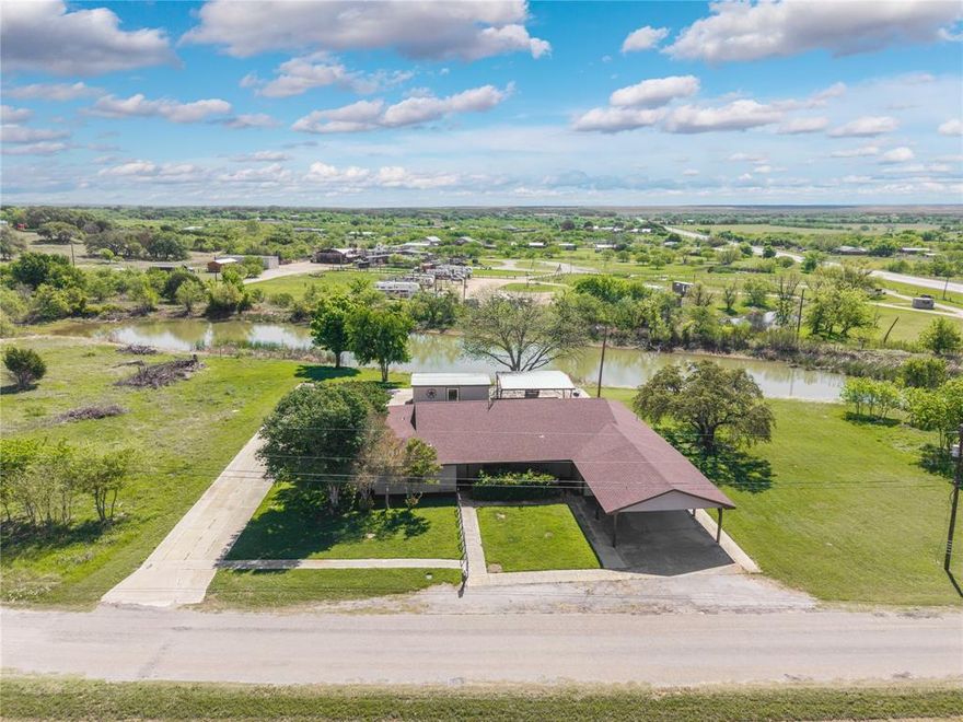 Welcome to your private slice of country living at 100 CR 319 in Early, TX! Situated on 5.6 beautiful acres, this property offers the perfect blend of space, comfort, and peaceful seclusion. 

This charming 3-bedroom, 2-bath home features an inviting open-concept layout, where the spacious living room flows seamlessly into the dining area and kitchen. The kitchen is designed with both functionality and gathering in mind, complete with a large island that provides additional seating and prep space—perfect for hosting family and friends.

Each bedroom is generously sized, offering comfort and flexibility, while the abundance of storage throughout the home ensures everything has its place. You’ll especially love the large walk-in closets that provide plenty of room for organization and convenience.

Step outside and enjoy the true highlight of this property—a picturesque pond right in your backyard, creating a serene setting for relaxing evenings or peaceful mornings. The home also features both a front porch and a back porch, ideal for soaking in the quiet surroundings and enjoying the natural beauty of the land.

For those who love to entertain, the covered outdoor area in the back is perfect for gatherings, barbecues, or simply unwinding. Additionally, a versatile storage shed offers endless potential—it could easily be transformed into a workshop, home office, or even your dream outdoor kitchen space.

Parking is never an issue with a 2-car garage, a 2-car carport, and ample additional space for guests, trailers, or recreational vehicles.

If you’ve been searching for a property that offers space, privacy, and endless possibilities, this one checks all the boxes. Come experience the peaceful lifestyle this beautiful property has to offer!