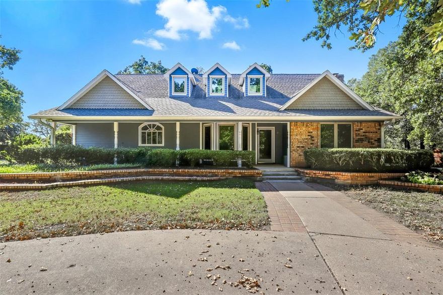 Welcome to your dream home, nestled on 2.62 beautiful acres in an incredibly convenient location! You'll love being close to schools, shopping, and the metroplex. This adorable house greets you with a charming gated circle drive and a cozy front porch, perfect for relaxing after a long day.
Inside, the inviting living area features warm wood floors and a wood-burning fireplace, making it the ideal spot for cozy winter nights. The bright kitchen is a true delight, boasting an island, stainless steel appliances, and plenty of cabinets and counter space for all your culinary adventures!
You'll adore the spacious primary suite, complete with its own fireplace and an ensuite bath that has a jetted tub, separate shower, dual sinks, and a skylight to brighten your day! There's also an additional bedroom downstairs for convenience, while upstairs you'll find two more comfy bedrooms that share a cute bathroom. The huge great room is a versatile space that can become your media haven, craft room, or game room—whatever fits your lifestyle! Step outside to the peaceful back patio, where you can sip your morning coffee and enjoy the sounds of nature among the trees. Plus, there's a separate workshop with electricity, along with extra storage for your lawn equipment.This charming home truly has it all and is ready for you to create wonderful memories! Don't miss the chance to make it yours!