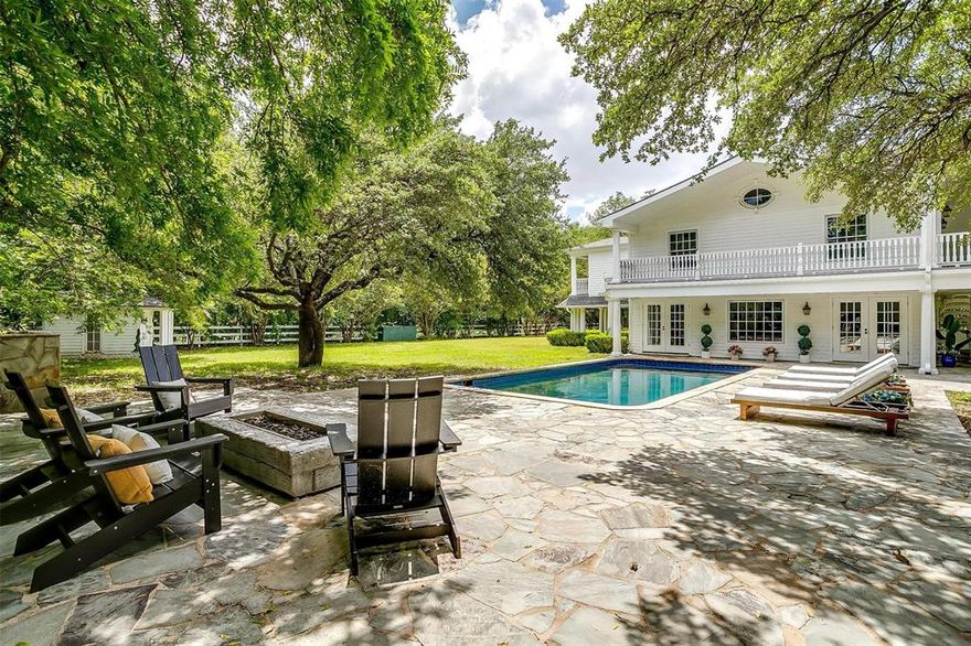 Just 30 minutes from Dallas and DFW Airport, Anns Lane Estate offers a rare opportunity to own a premier equestrian property in the sought-after community of Parker, TX. Set on 15± acres, this estate blends refined country living with modern luxury. The 6,400± sq ft main house is a 6-bedroom, 6.5-bath showcase of craftsmanship that has been beautifully renovated with custom details.  The home features antique Texas Oak floors, reclaimed doors and windows, and exquisite architectural details. With two living areas and a covered outdoor living space, it offers multiple places to entertain or unwind. The chef’s kitchen includes marble finishes, a custom antique island, Viking appliances, dual Bosch dishwashers, a Miele coffee maker, and GE Monogram refrigeration. The dining room shines with antique lighting and a custom metal ceiling. Each bedroom features an ensuite bath, custom vanities, and French doors opening to porches or balconies. The detached polo room includes antique pine walls, a show-stopping early 1900s soda shop bar, a wood-burning fireplace, projector system, and office with views of the pasture. The custom four-stall barn by American Stalls features chiseled quartzite walls, Dutch doors, paddocks, slate stone tack room, kitchenette, and reclaimed Anns Lane fence posts used as saddle racks. The grounds offer 4 individual turnouts and a large, plumbed main pasture plus premium vinyl-wrapped solid wood fencing, 360-degree predator fencing, and T-post pasture fencing. Currently Ag Exempt. ***ANNS LANE IS A PRIVATE DRIVE - NO PUBLIC ACCESS, NO DRIVE BYS.