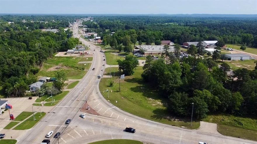 PRIME commercial land in Gilmer, TX! Almost 1.5 acres of level raw land at the busy intersection of US Highway 271 and State Highway 300. Accessibility is key, with an estimated 350 feet of Highway frontage and 370 feet of city street frontage! Perfect for catching customers attention, with a traffic light stopping people right at your door step. Also, conveniently located next to the Gilmer Jr. High where many school events take place. Utilities are set! One of the last grandfathered billboard locations in Gilmer is on site, giving buyers the opportunity for passive income. The possibilities for this commercial property are endless!