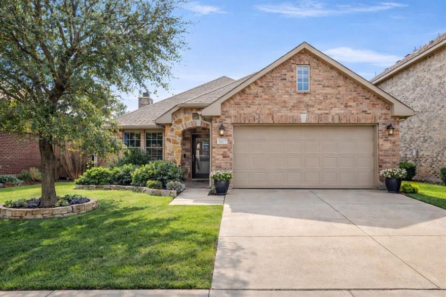 MOVE-IN-READY gem!! Conveniently located near shopping centers and within the Award-Winning Northwest ISD, this home boasts an expansive open floor plan . The generous living space features a cozy wood-burning fireplace, flowing seamlessly into dual dining areas. The kitchen shines with granite countertops, a spacious island, abundant cabinetry, and a walk-in pantry. Throughout, enjoy durable vinyl plank flooring with NO CARPET. All bedrooms offer ample scale and substantial closet space, while solar screens on the windows enhance energy efficiency. Outside, professional landscaping includes full gutters, and the backyard impresses with a large covered patio for outdoor enjoyment. This opportunity WON'T LAST! Motivated Seller—Schedule a viewing today!