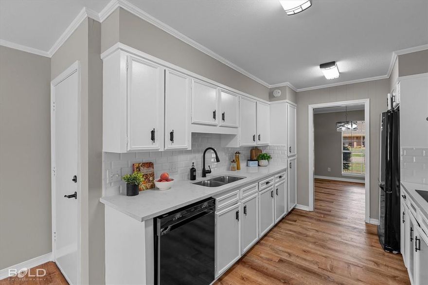 New to the Town South neighborhood this modern updated single-story brick home has 2 primary bedroom suites.  It features 4 spacious bedrooms and 3 luxurious bathrooms making it perfect for someone needing a lot of space.  Step inside to your formal front living room followed by a galley style contemporary kitchen. The galley style kitchen has a double oven and electric cooktop with plenty of cabinet space for meal prep and entertaining.  Off of the kitchen there is a breakfast dining nook as well as a laundry room that leads you to your spacious 2 car garage.  The main living space contains accent beams that flow toward a floor to ceiling brick fireplace with built in beautiful bookshelves on both sides. Each bathroom contains fully remodel modern finishes that you will be sure to enjoy. The true treat is the split level double primary suite bedrooms where you can enjoy tour privacy and functionality.  Additional upgrades include new LVP floors throughout and a brand-new roof.  This home has a spacious backyard located in a desirable neighborhood just minutes from Youree drive, parks, shopping, and dining.   Schedule your private showing today and don't miss the opportunity to make this home your own!