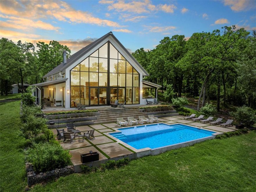 Welcome to this stunning rural retreat tucked away on 61+ acres in Leon County. Perfectly suited for those seeking a peaceful family residence or an inviting retreat, this property promises a remarkable blend of comfort, luxury, and adventure.  The residence has 4 spacious bedrooms, each with an en suite bathroom, and 1 bunk room (sleeps 8), expertly designed to accommodate family & guests. The kitchen is a culinary dream featuring commercial-grade Thermador appliances, perfect for both daily meals and entertaining. The whole house dehumidifier ensures year-round comfort with optimal air quality. The cutting-edge Savant system elevates your everyday experiences by effortlessly integrating music control at the touch of your smartphone.  Indulge in the breathtaking infinity pool, seamlessly integrated with an outdoor living area. It's an ideal setup for hosting gatherings or simply enjoying a tranquil evening under the stars.  The property's 5 acre lake and wildlife-friendly environment invite endless adventure. Enjoy long trails for hiking, horseback riding, or ATV exploration, presenting opportunities for new experiences every day.  Additional features include a 40'x36' barn and a 40'x18' equipment shed, providing ample storage for equipment and hobbies. A 1,000-gallon underground propane tank ensures efficient energy solutions, while the low-maintenance design of the home offers peace of mind to its owners.  This residence offers more than just a home. It's your sanctuary, a place to unwind, create, and live life with unparalleled leisure.