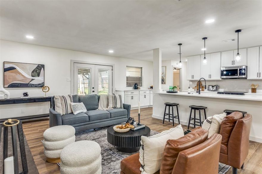 Welcome to this beautifully transformed home located in a spacious, established neighborhood just minutes from TCU and Lockheed Martin. Completely renovated from top to bottom, this property offers the luxury and feel of new construction paired with the charm of a mature community. The open-concept layout is perfect for modern living and entertaining, featuring keyless entry, brand-new interior and exterior paint, and 20-mil SPC luxury vinyl flooring throughout. 

The living area is anchored by a sleek modern electric fireplace, creating a warm and stylish focal point. The custom-designed kitchen is a true showstopper, showcasing fully renovated cabinetry, luxury quartz countertops, a double sink, brand-new garbage disposal, and brand new appliances from Best Buy, including a Samsung Bespoke slide-in electric range with precision knobs. The dining area is elevated with a striking modern chandelier, adding to the home’s upscale appeal. Both bathrooms have been fully remodeled with double vanities, luxury tile finishes, modern cabinetry, quartz countertops, and new fixtures. The primary suite also features a large double closet, offering both comfort and functionality. Additional upgrades include new plumbing, electrical, doors (including the front door), a brand-new water heater, and an insulated, fully renovated garage with 4-foot LED ceiling light fixtures. 

Both the roof and HVAC system are in great condition, ensuring year-round comfort. Step outside to a large backyard with endless potential for entertaining, outdoor living, or future expansion. Solid wood beams at the front entry enhance curb appeal and welcome you home. Bonus: a 12-month Home Owners Warranty is included at closing.

Conveniently located near major employers, dining, shopping, and entertainment, this rare opportunity won’t last long. Schedule your private showing today!