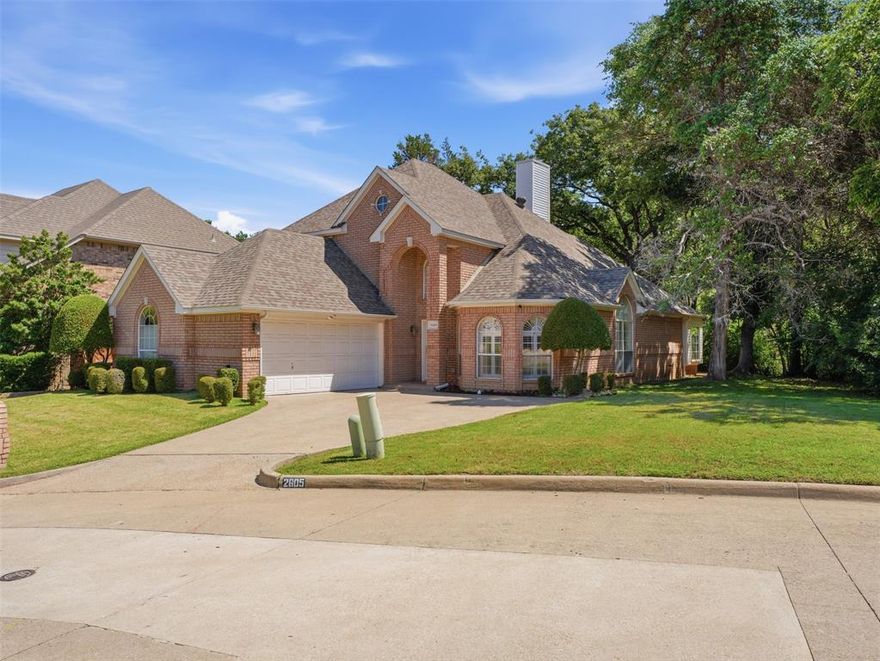Welcome home to 2605 Hidden Ridge, tucked away in a private HOA community located in North Arlington! As you walk in, you are greeted with a spacious dining room and staircase that leads to 3 upstairs bedrooms as well as a family room or game room. On the first floor, there is an open-concept kitchen and living room space along with a spacious primary suite. The living room has a brick fireplace that connects to the primary as well. The primary bedroom has a separate updated shower, massive soaking tub, dual vanities, and a walk-in closet. On the exterior, there is a screened double-decker patio that backs up to a wooded area—perfect for enjoying your privacy, grilling, or hanging out with friends. There is an oversized two-car garage as well on the front of the property. Major capex upgrades and updates include a new roof replaced in 2018, HVAC replaced in 2018, a new concrete front driveway, flooring and carpet replaced in 2023, all plumbing fully replaced to PEX in 2023, and a water monitor added in 2023 to detect any water leaks throughout the property. This property is centrally located in the DFW metroplex, close to the Entertainment District in Arlington, with easy access to major highways and less than 20 minutes from both Downtown Dallas and Downtown Fort Worth, and less than 15 minutes from DFW Airport. Come make an offer before someone else does!