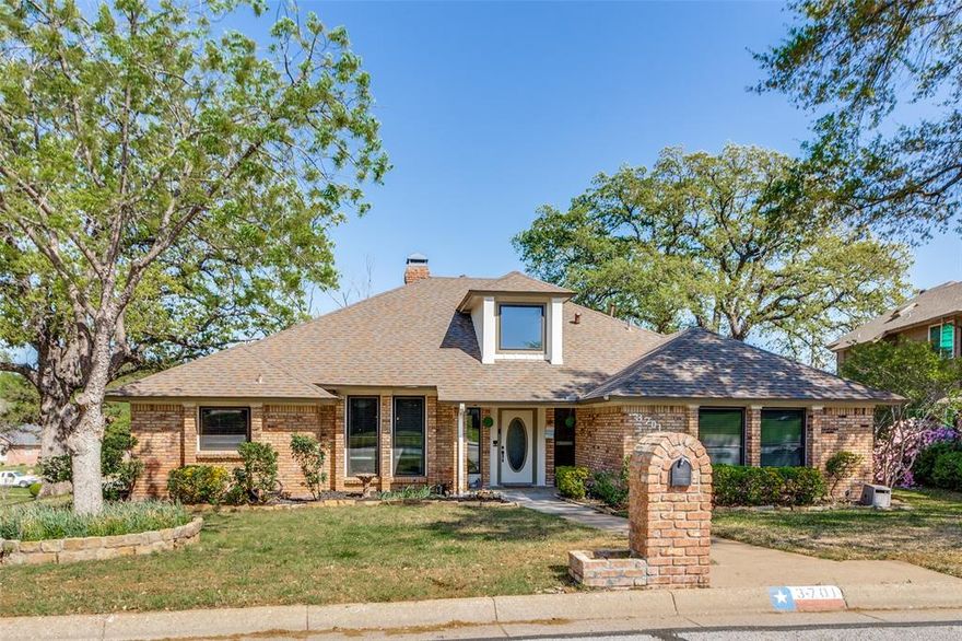 This beautiful home sits on a desirable corner lot in a highly sought-after neighborhood zoned for Martin High School, offering an excellent location with convenient access to shopping, dining, and major thoroughfares. Rich hardwood flooring enhances the main living areas, while the inviting living room features a cozy gas-log fireplace with a charming brick hearth, built-in shelving, and a convenient wet bar—perfect for relaxing or entertaining. Designed with flexibility in mind, the home includes two spacious living areas along with both formal living and dining spaces, allowing you to tailor the layout to fit your lifestyle. The eat-in kitchen is equipped with granite countertops and ample cabinetry for all your storage needs. The secondary living room has an additional fireplace and is equipped with a Bose surround sound system that conveys with the house! The primary suite offers a peaceful retreat, complete with an ensuite bath featuring dual vanities, a separate shower, and a soaking tub. In addition to the thoughtfully separated secondary bedroom for added privacy, the home includes two additional bedrooms, providing plenty of space for family, guests, or a home office. Step outside to enjoy a generous deck ideal for outdoor dining and gatherings, along with a sparkling pool that’s perfect for cooling off on warm days. Schedule your showing today!