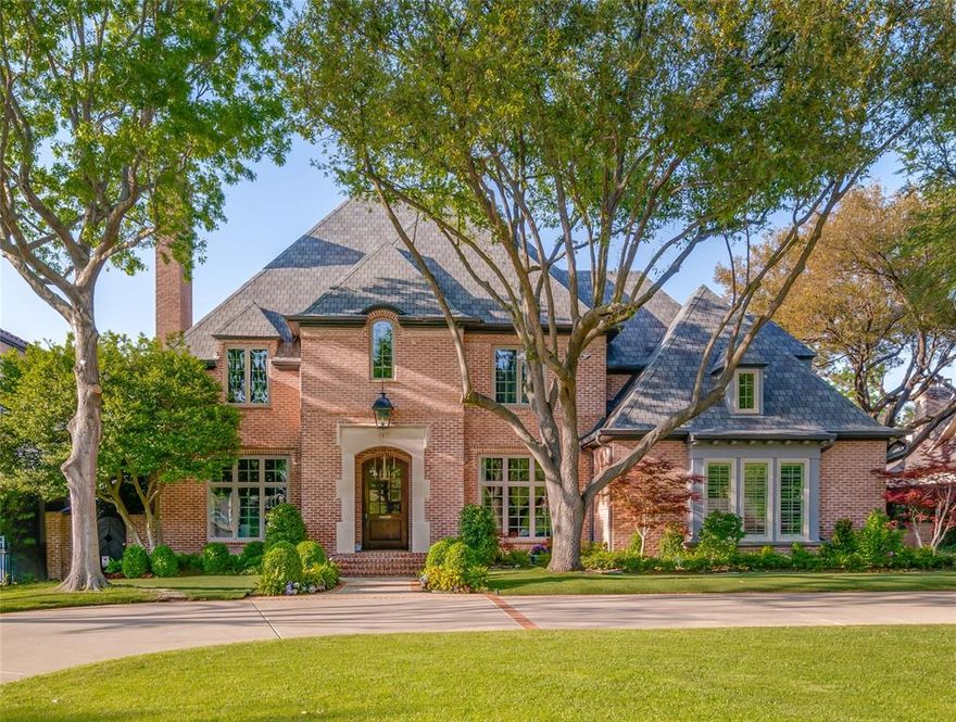 Welcome to timeless elegance in this beautifully updated Preston Hollow home, located on prestigious Park Lane. This timeless home is truly an Ambassador's residence. Situated on an expansive 100x190 lot, and blending traditional charm with modern sophistication, this home is as functional as it is stunning. The thoughtfully and extensively renovated interiors reflect superior craftsmanship and enduring quality: featuring a solid pier-and-beam foundation, rich solid wood doors and custom moldings, beadboard, cathedral ceiling and beautiful wainscotting, all custom features that sophisticated buyers look for.  The layout has been meticulously reimagined for today’s lifestyle and the 3rd floor has been added. Recent enhancements include a 50-year architectural shingle roof, radiant barrier, smooth wall finishes, and a completely remodeled kitchen with a warm East Coast feel. The chef’s kitchen boasts a vaulted ceiling, all new custom cabinetry and soapstone countertops, plus high-end appliances, two sinks, two dishwashers, a large pantry, and a separate butler’s pantry for additional storage. All 5 baths have been stylishly updated, and beautiful hardwood floors have been added in all five bedrooms. The main level features a serene primary suite with a sitting area, a spa-like bath, and spacious walk-in closet. Upstairs, you’ll find four additional bedrooms, three full baths, a game room with replaced carpeting and new custom shelving, a media room with projection equipement, screen, a wet bar, and a third powder bath—plus laundry rooms on both levels for ultimate convenience. The third floor is completely new and could serve as workout area, office or playroom; it can be your dream space. The three-car garage includes an air-conditioned bay—perfect for your prized vehicle, workshop or home gym. Step outside into your private outdoor oasis, complete with a sprawling patio, sparkling waterfall pool, and lush outdoor living area designed for year-round enjoyment.