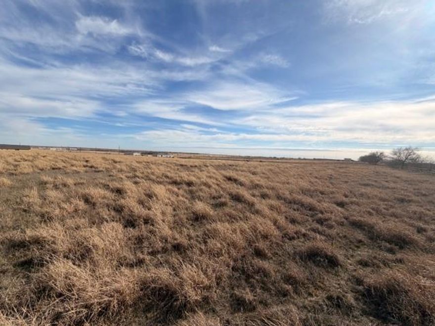 Beautiful 4.1-acre interior lot located just approximately 500 feet off the main road, offering privacy with easy access. The property is fully cleared of trees and ready for development, with perimeter fencing already in place. Gently rolling open pasture provides an ideal homesite with wide-open views and plenty of space for a custom home, barndominium, or small ranch setup. Electric is available nearby with utility poles along the road. Peaceful rural setting while still conveniently located to town amenities. No floodplain, no city restrictions, and plenty of room for livestock, shop, or recreational use. A great opportunity to own a spacious tract in a growing area.