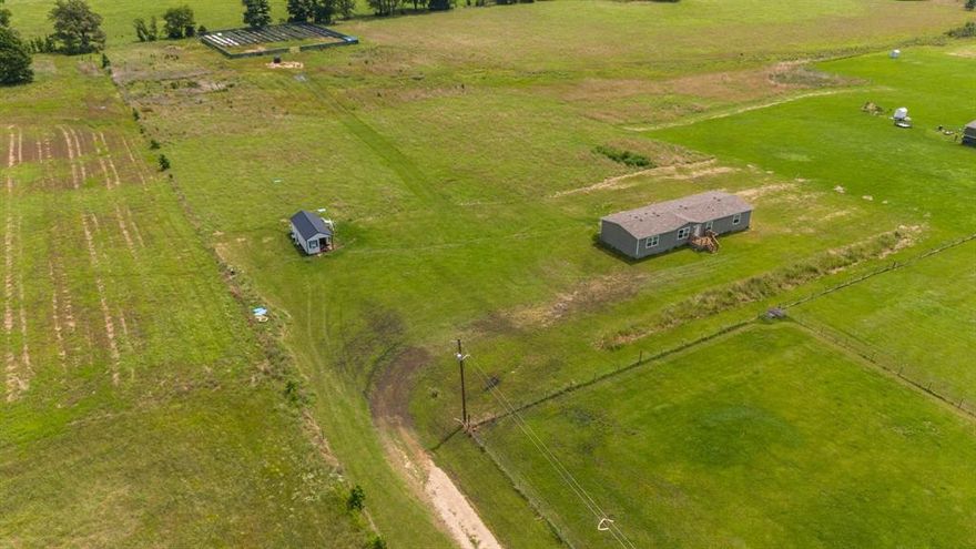 Welcome to your own little slice of paradise situated on 5.640 acres. Beautiful double wide mobile home built in 2024 is located in the family friendly growing city of Grand Saline! This home has been gently lived in for a little over a year and continues to be well maintained. This doublewide home offers an open floor plan with a spacious living area making it great for family time as well as entertaining family and friends. Formal dinning area is TEXAS SIZE and can accommodate big family gatherings. Dinning area is also open to the living area and kitchen. The four bedrooms are all well appointed. The seller also had an extra custom building built that's 14x28 that's insulated and also has electric. It would be great set up for a tiny home or a man cave OR your she shed! THIS ONE WON'T LAST LONG SO DON'T DELAY COME AND SEE IT TODAY!