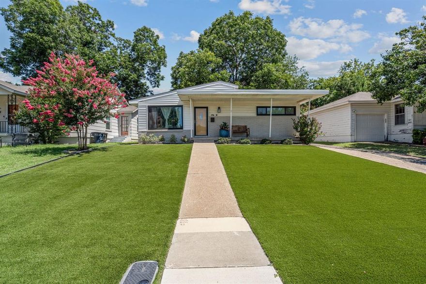 Step into this updated and meticulously maintained Fort Worth gem, just steps from the excitement of Dickies Arena! Nestled on a generous lot with pristine artificial turf in front and back, this 2 bedroom, 1.1 bath home effortlessly blends modern style with everyday comfort. At the front of the home, a bright living area and formal dining welcomes you—before leading into the eat in kitchen. Here, crisp white cabinetry, gleaming granite counters, stainless steel appliances, and a classic subway tile backsplash await, with an open concept flow into the spacious family room. Retreat through elegant French doors to your private backyard: a pergola shaded patio overlooking lush landscaping, a handy workshop, and an oversized carport with gated drive. Additional highlights include fresh neutral paint, gleaming hardwood floors, and updated recessed lighting throughout.