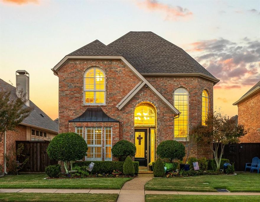 Step into a home that feels like a hidden gem — light-filled, welcoming, and quietly elegant. With 3 bedrooms, 3 baths, and soaring ceilings, this residence balances comfort with a hint of whimsy. A see-through fireplace connects the living and dining rooms, while skylights dance across granite countertops in the stylish kitchen.  The primary suite offers a peaceful retreat with its own fireplace, sitting nook, and doors opening to the pool terrace. Upstairs, a bright loft and additional bedrooms add flexibility and fun.  Outside, enjoy your own private escape — a sparkling pool and spa surrounded by lush landscaping, perfect for lazy afternoons or starlit evenings. Tucked in a secure gated community within the Carrollton-Farmers Branch ISD, this home blends everyday comfort with resort-like ease.  Come see where light, laughter, and livability meet.