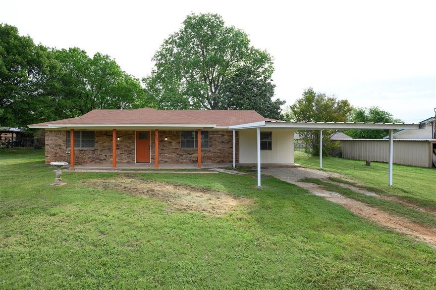 This well-maintained home sits on a large lot in the heart of Old Town Springtown, where convenience meets small-town charm. Enjoy relaxing mornings on the spacious front porch, just steps away from the town square, library, schools, and parks. Inside, the bright and inviting living area and eat-in kitchen offer a generous layout with ample storage, making the space both functional and welcoming. The home also features a versatile bonus room that could easily serve as an additional bedroom, office, game room, or media room—the possibilities are endless. You’ll appreciate the separate laundry room and durable luxury vinyl plank flooring throughout the home. Step outside to a covered patio overlooking the fully fenced, oversized backyard—perfect for entertaining, relaxing evenings, or enjoying the peaceful surroundings. The property also includes a convenient brick storage building. Experience the best of country living while still being close to big-city amenities!