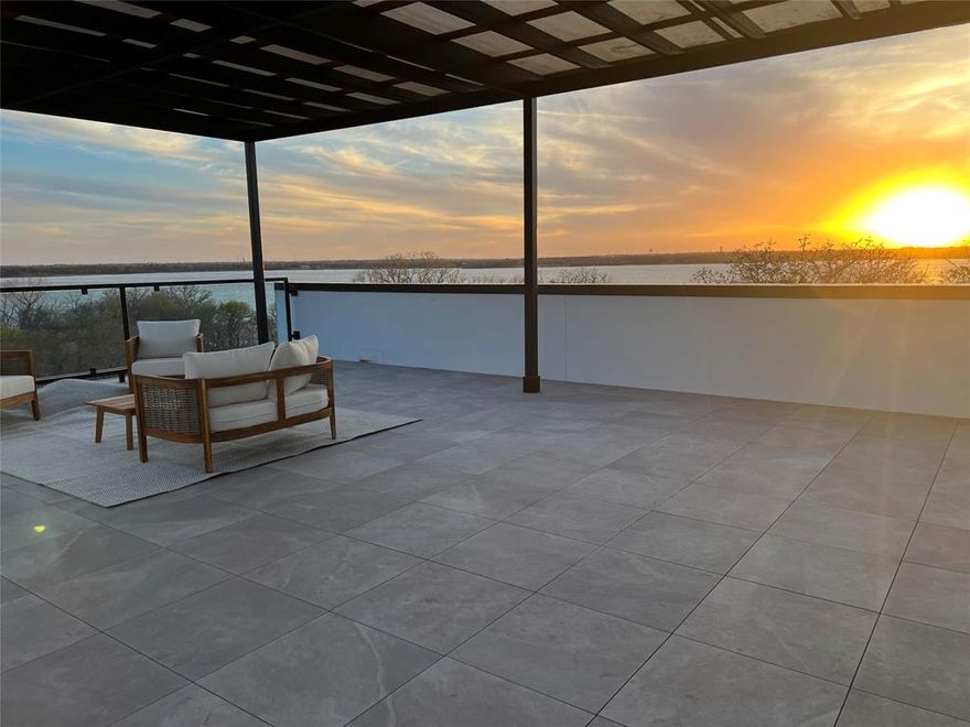 Newly completed in February 2025, this exceptional estate, multi-generational home, is situated on a private 1.33-acre cul-de-sac lot with direct access to Lake Lewisville and 4 acres of adjacent Corps of Engineers property for ultimate privacy.
The home boasts superior ICF (Insulated Concrete Forms) construction, utilizing 2 million pounds of cement and 168 piers. The interior features six spacious bedrooms, six full baths, and two half baths, making it ideal for a variety of living arrangements. The gourmet kitchen is appointed with Bentwood cabinetry, quartzite countertops and backsplashes, and high-end appliances. Pella custom windows and French doors are featured throughout, offering stunning lake views from every room. Additional highlights include a Sky Deck with panoramic views of Lake Lewisville, a full second kitchen upstairs perfect for multi-generational living, and a commercial-grade elevator. The full basement provides versatile design opportunities for a media room or bowling alley. Located near the Willow Bend Polo Club and Dallas Corinthian Yacht Club, this property on Oak View Ct presents a rare opportunity for luxurious lakeside living.