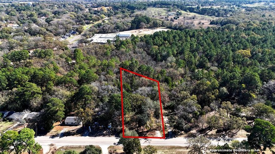 Hard to find and full of potential, this 1.13-acre wooded lot inside the city limits offers an ideal setting for your dream home. With utilities available at the road, the property features rolling terrain, mature trees for natural privacy, and a small creek that adds character and charm. Choose from multiple building sites—build near the road for easy access or take advantage of the elevated hilltop for seclusion. Conveniently located near Bel Air Elementary and the hospital, this serene tract provides both privacy and in-town convenience. Bring your plans and make it your own! No mobile homes permitted.